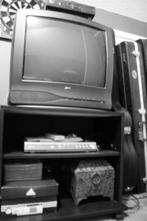 <img300*0:stuff/T.V._and_Stand_in_Black_and_White.jpg>